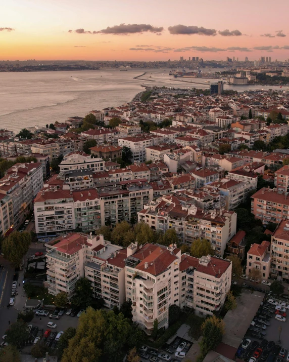 the city skyline with lots of white buildings near water