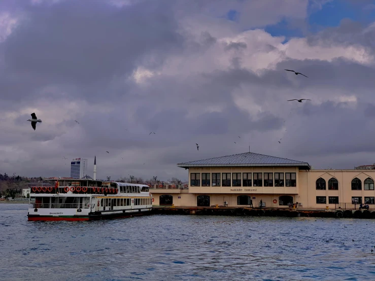 boat in a body of water near a building