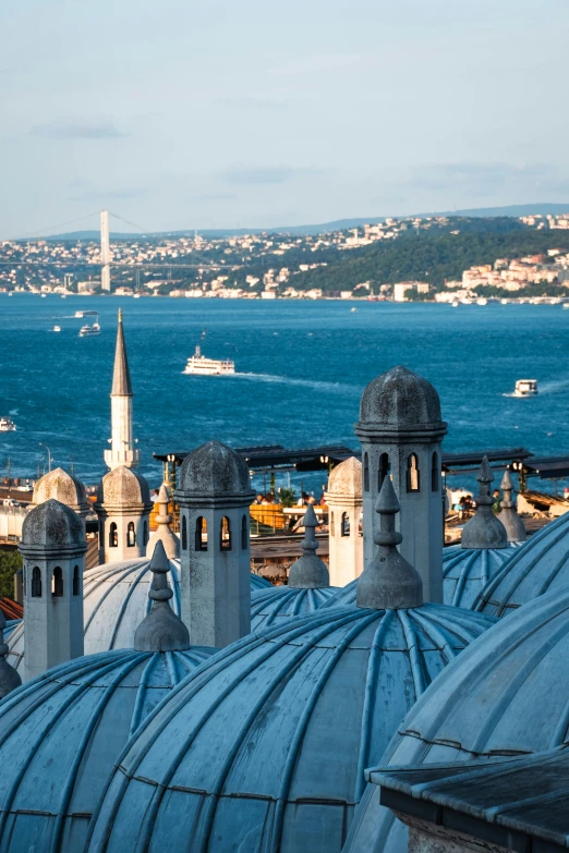 a view of several buildings on an ocean side