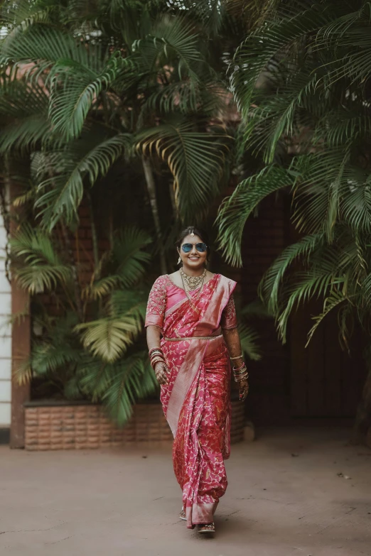 a woman in red is walking down the road