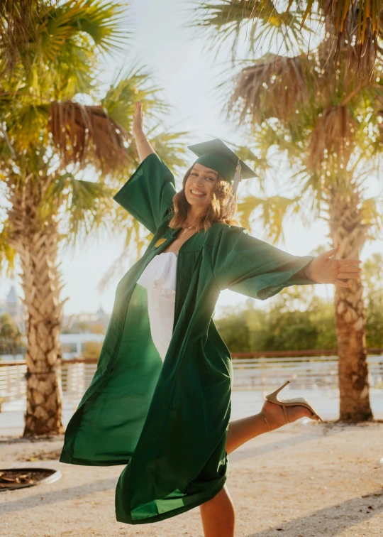 a graduate is standing and posing for a po