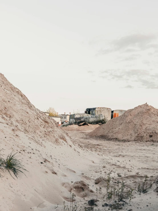 a truck driving through a sandy hill