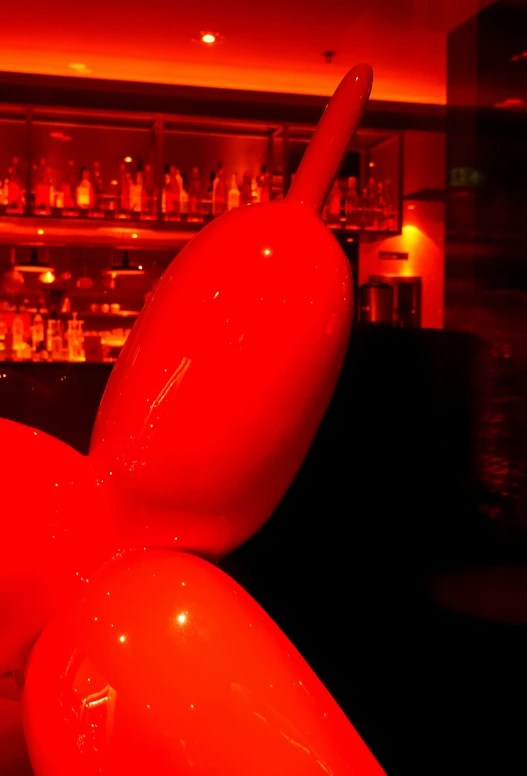 some plastic balloons in front of a bar