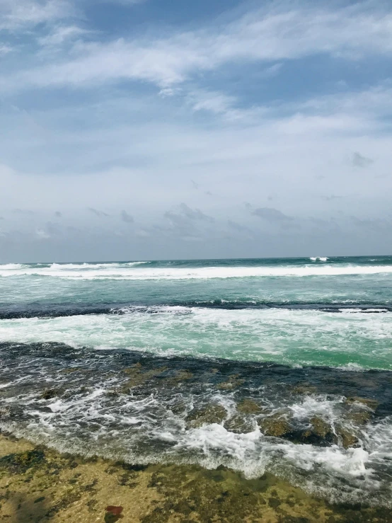 the body of water near a rocky shore