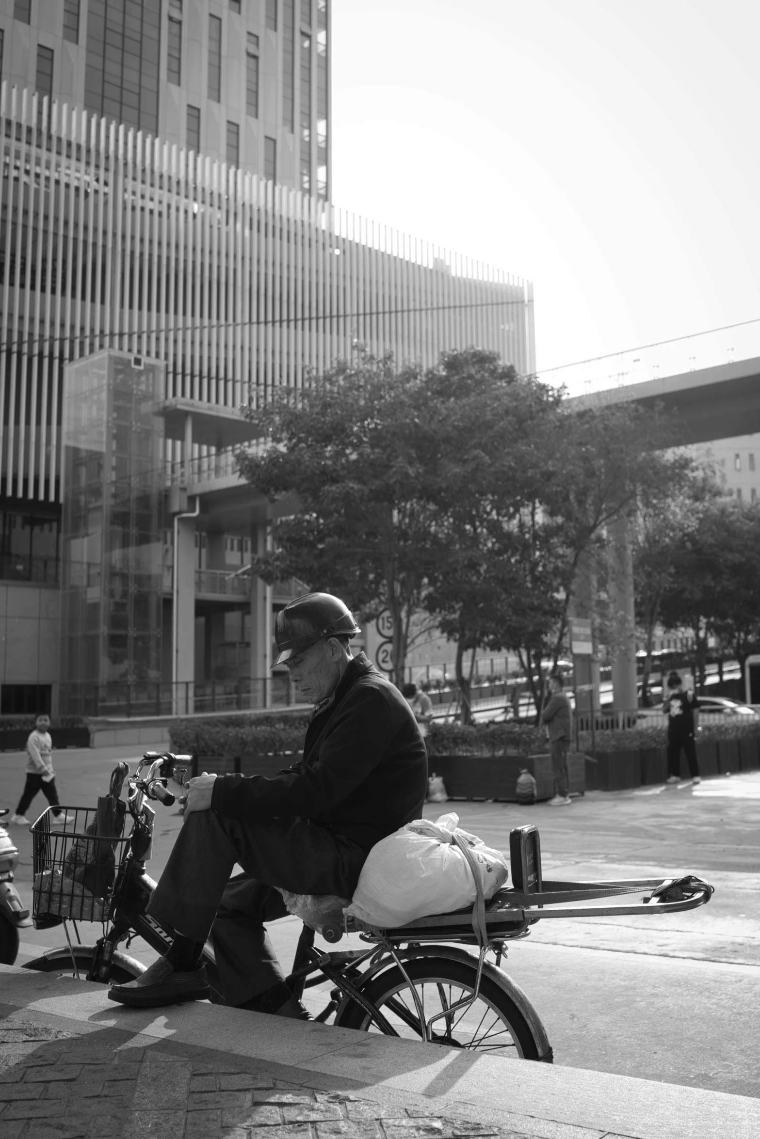 a man on a bike with other bikes behind him