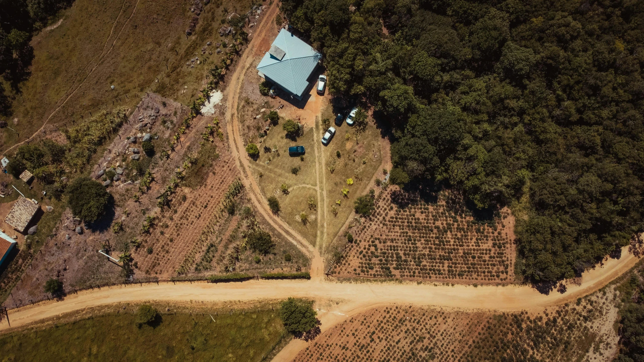 an aerial s of an empty dirt road