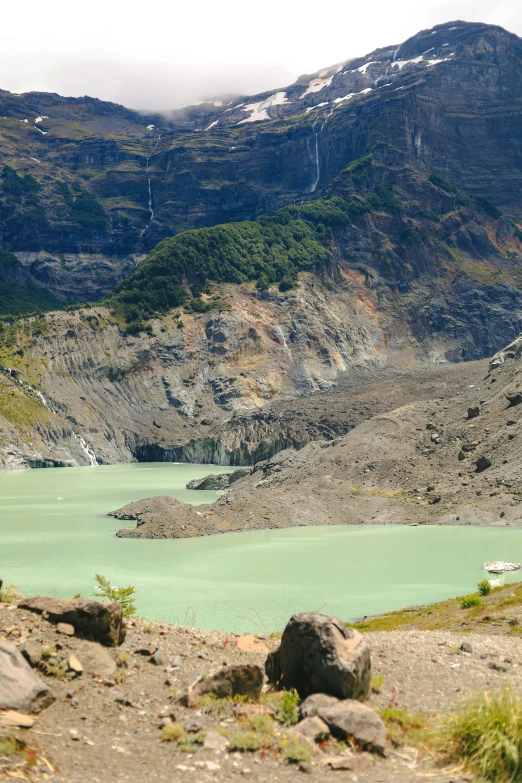 a large body of water in front of mountains