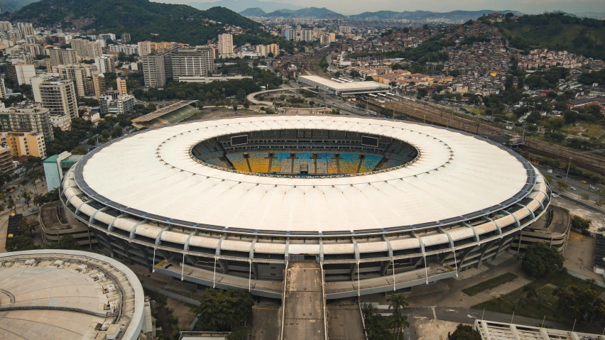 a large stadium with an oval white structure