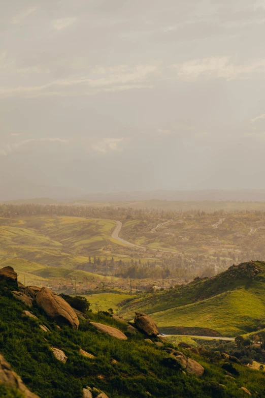 view of a hill, grassy hills and river