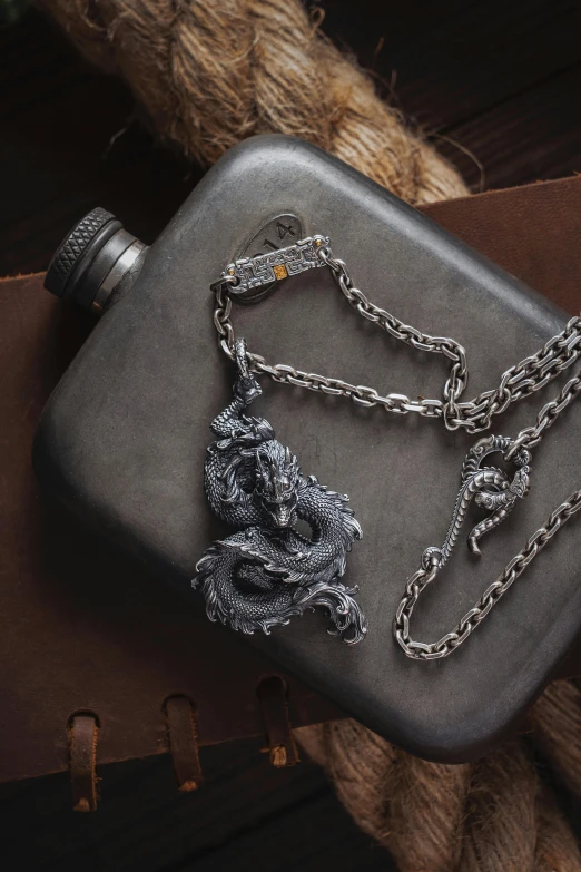 a flask with a chain and a knot on it