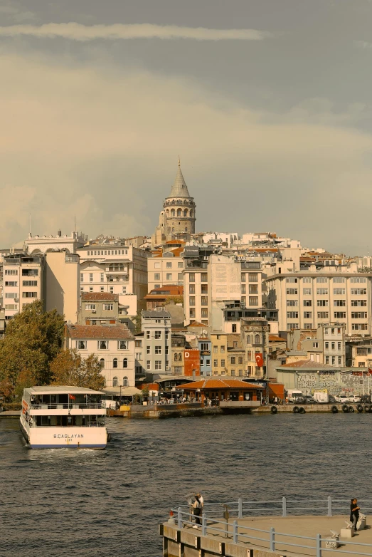 a river that has boats on it and some buildings in the background