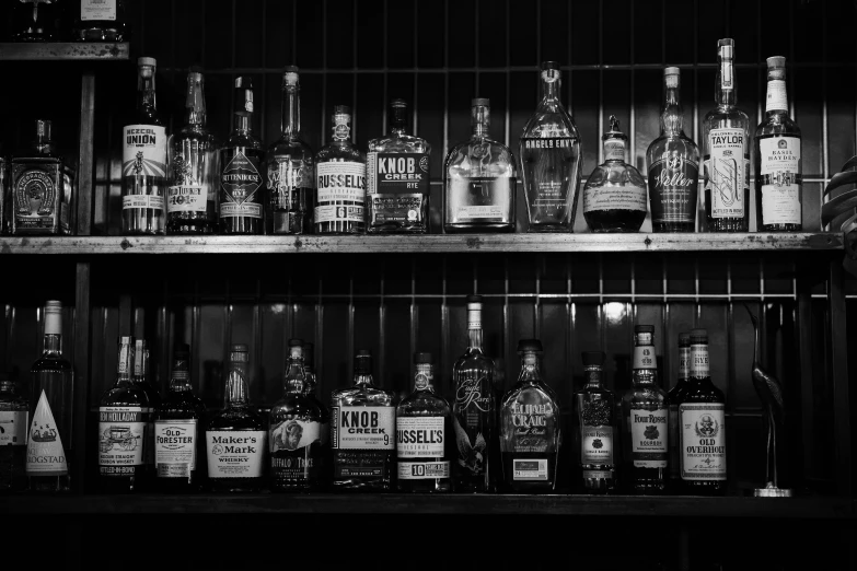 several bottles of liquor in a small shelf