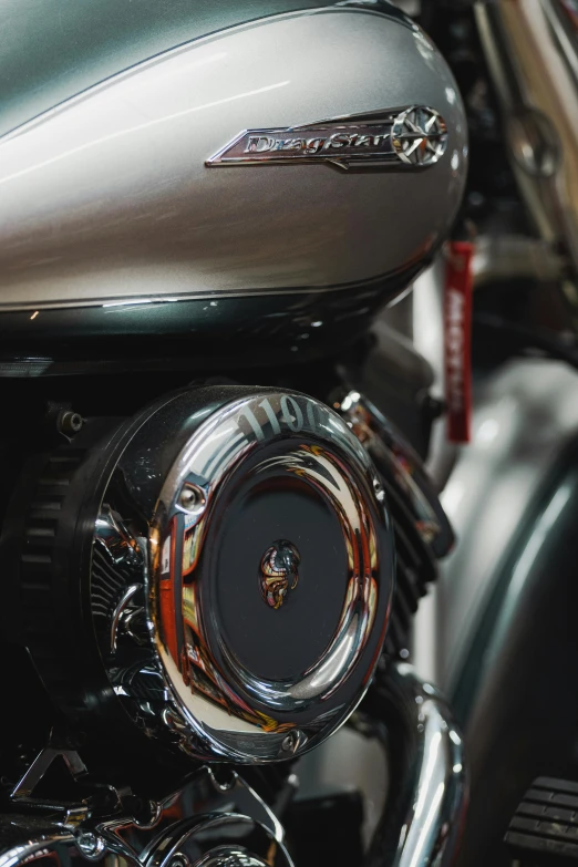 the front end of a motorcycle with chrome accents