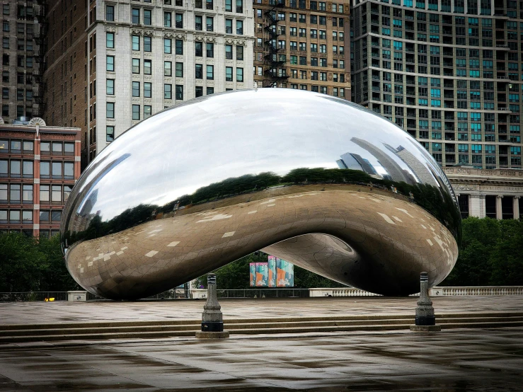 a large ball that is sitting in the middle of a plaza