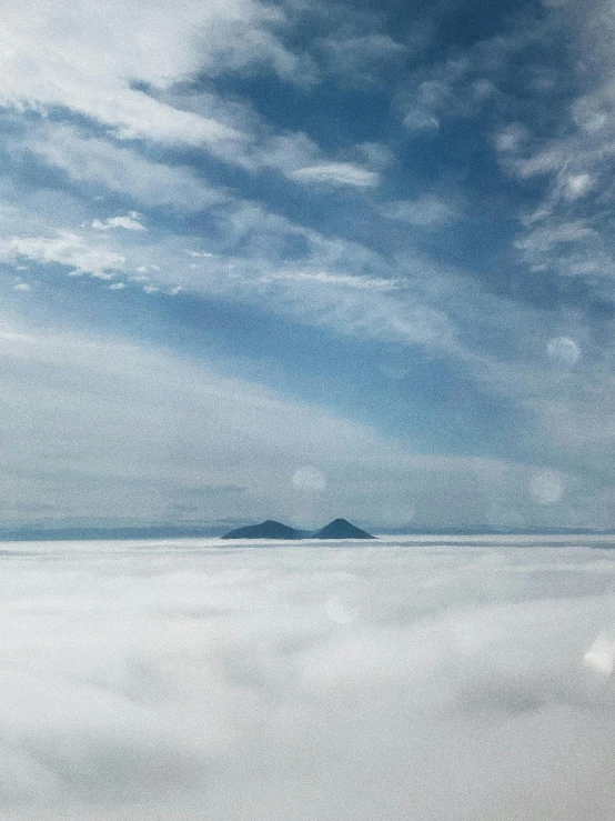 a very wide plain is seen under the blue sky