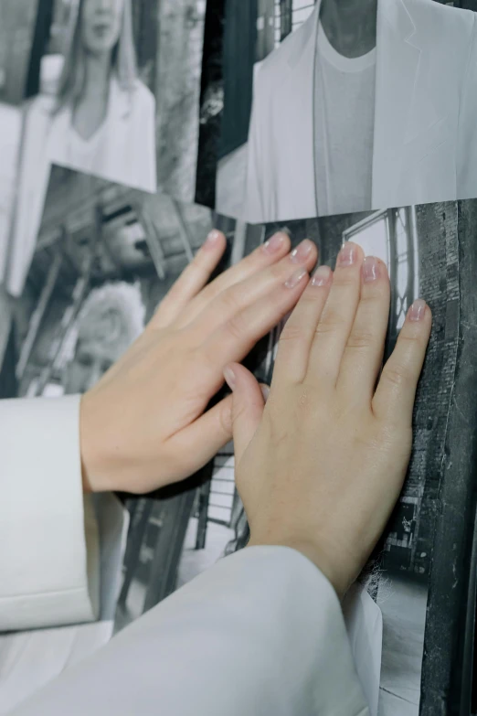 the hands of two people holding pictures together