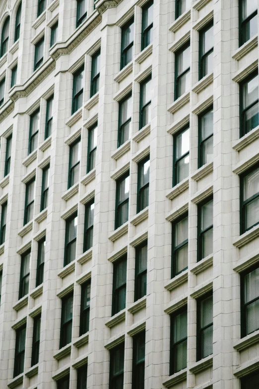 a tall gray building with lots of windows