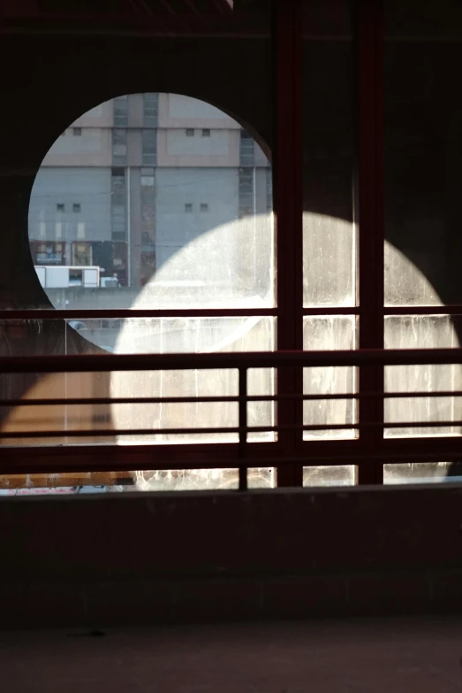 the top half of an arched window at a large building