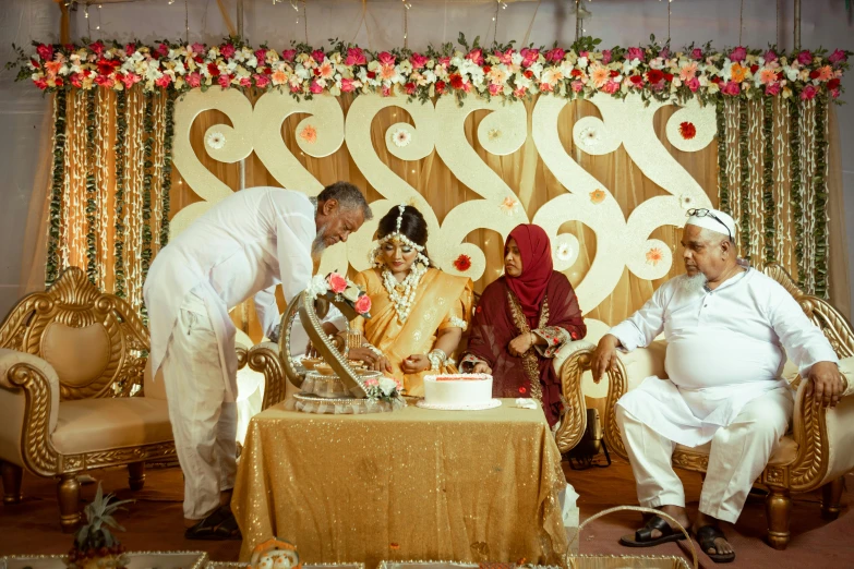 a man and woman standing by a wedding cake