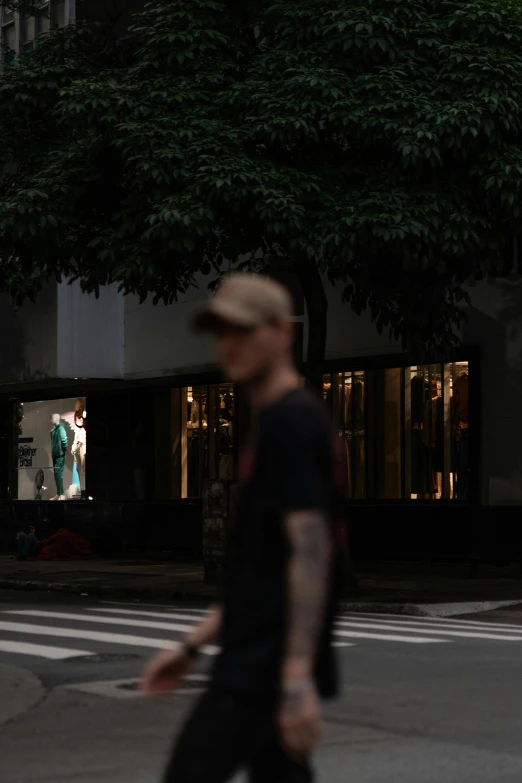 there is a man crossing the street with no one in sight