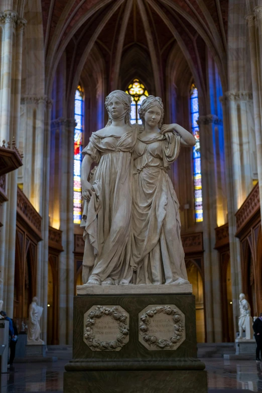 a couple of statues in the middle of a room