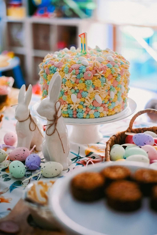 a table is set up with easter cake and treats