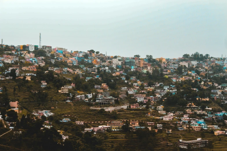 a city is seen from above with blue houses