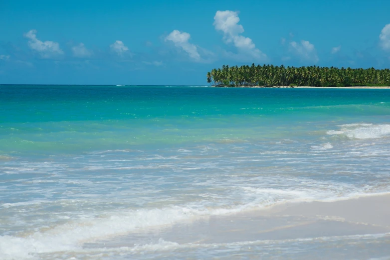 a lone island near the water is in the distance