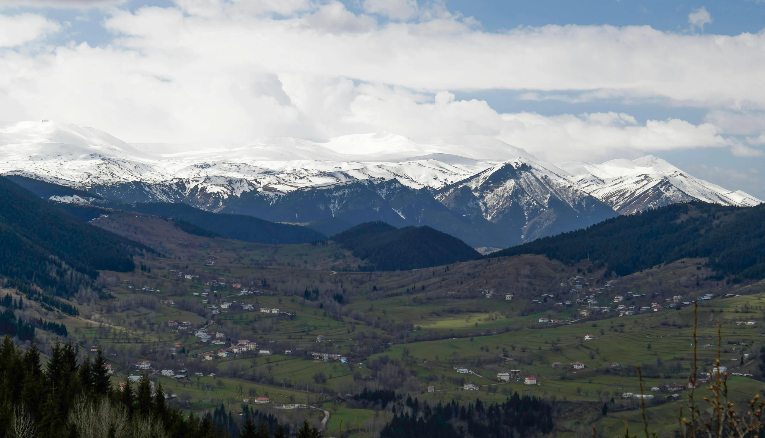 a village nestled in the valley of mountains