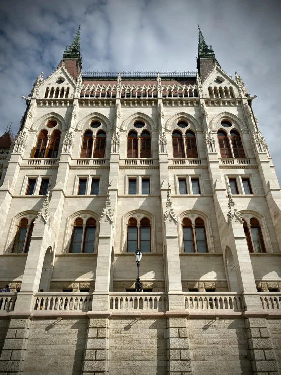 a white castle like building with windows and clock