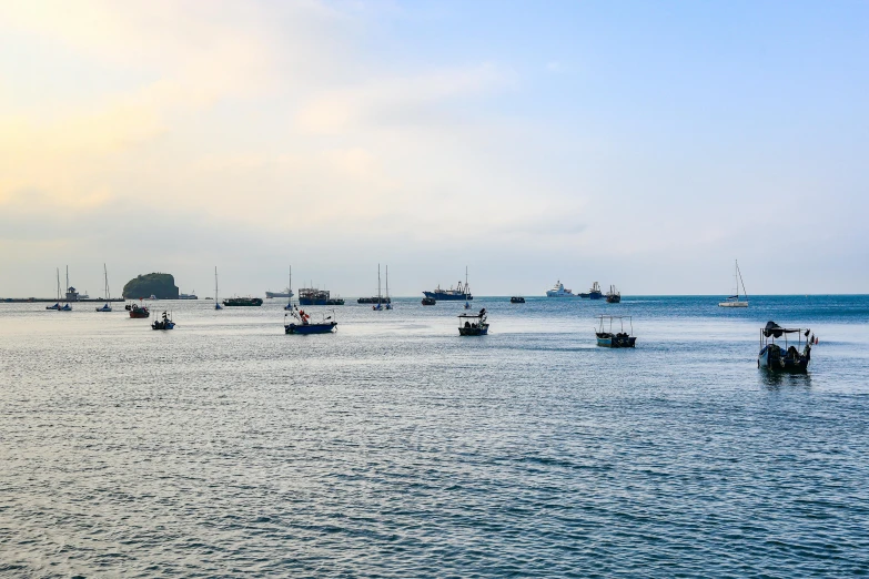 a group of boats that are floating in the water