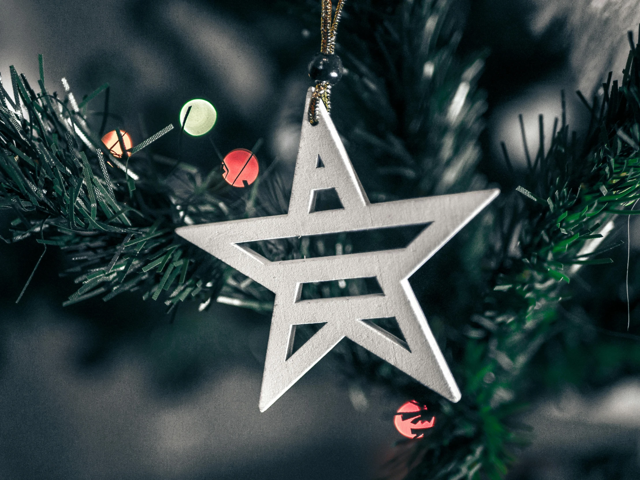 star ornament hanging on a tree