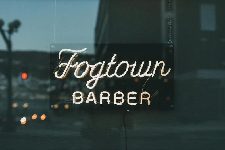 the sign in the window says fortown barber