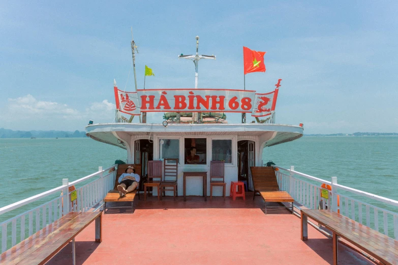 a boat sitting on top of a large body of water