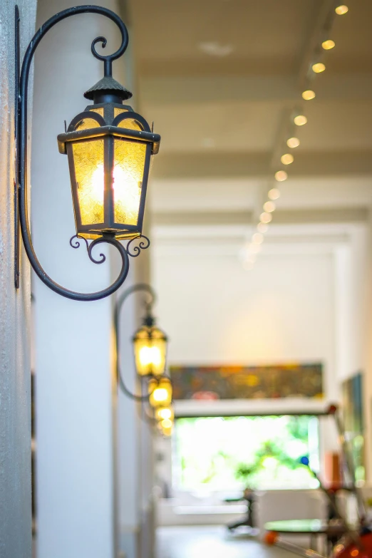 a large lantern light is attached to a wall