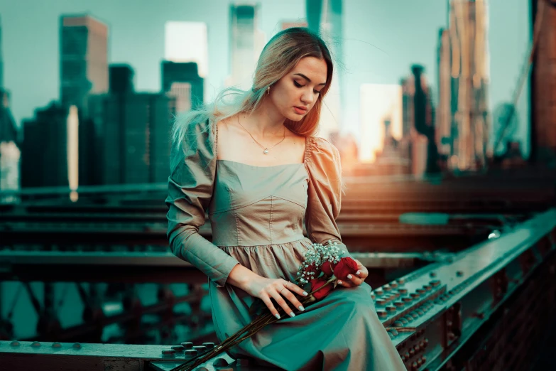 a woman is standing on a bridge wearing a dress