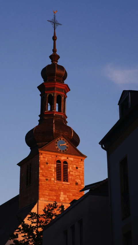 a small clock tower towering over a city