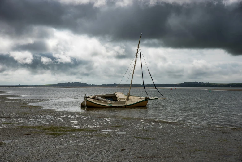 a sailboat anchored in a large body of water