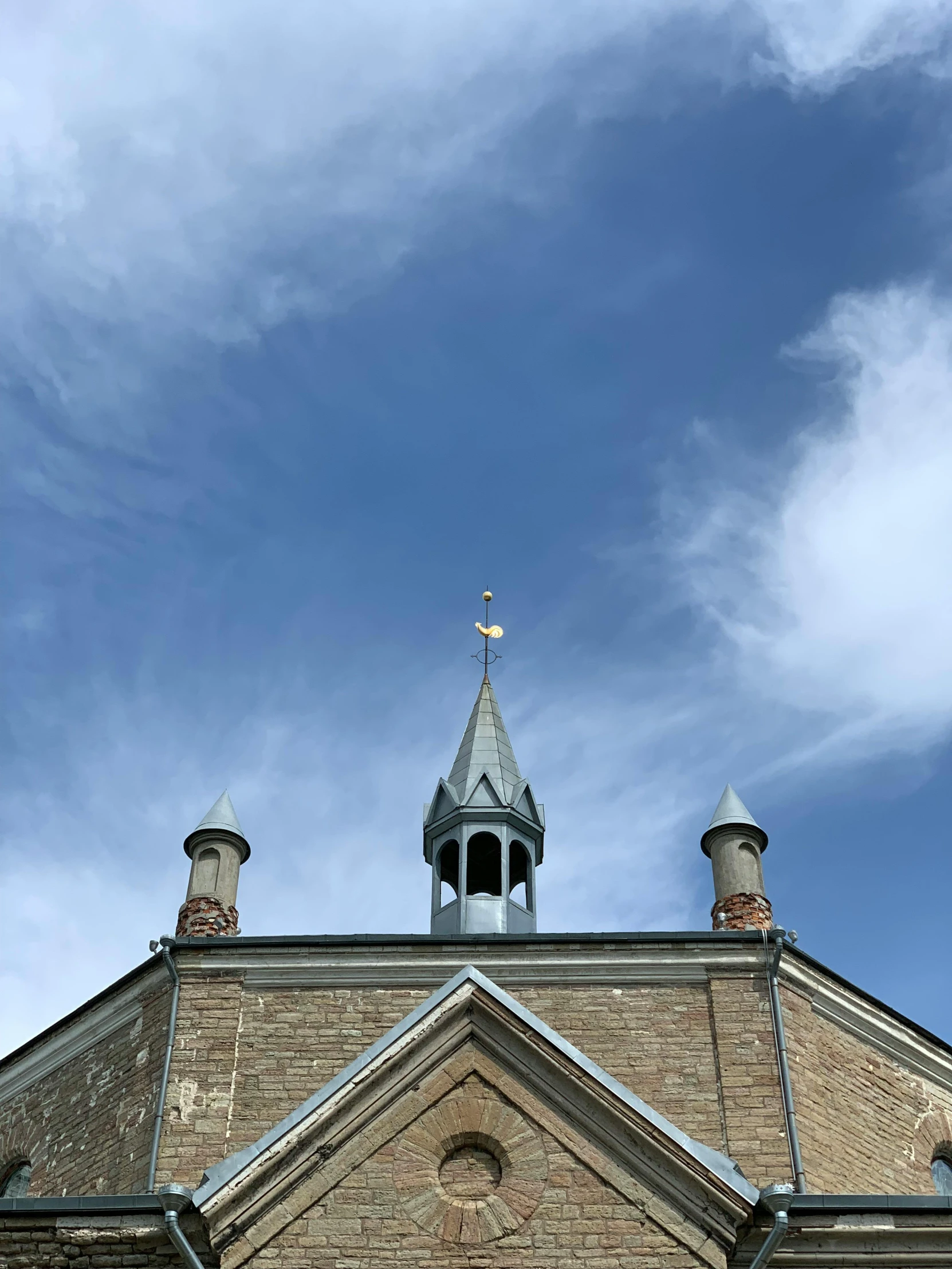 an image of a church steeple with blue sky background