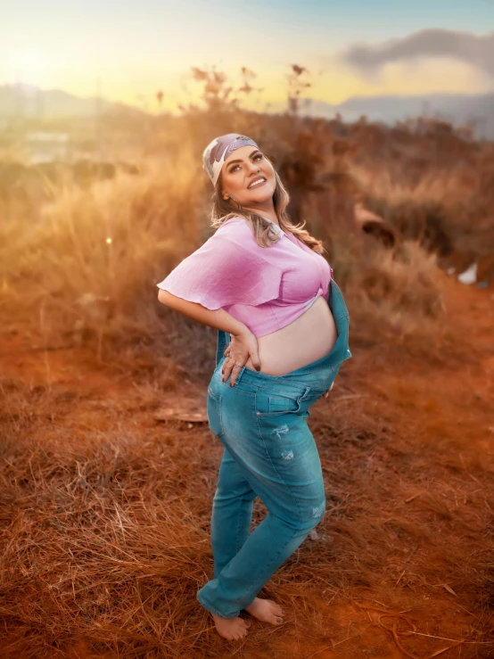 woman with big  standing in field smiling