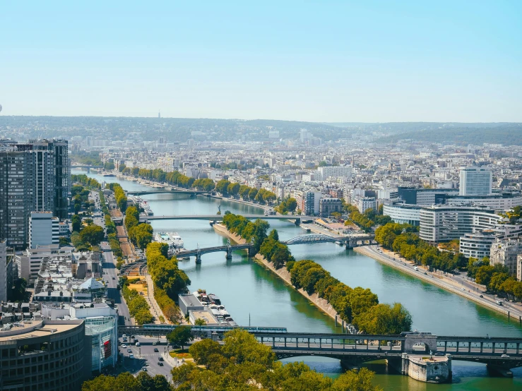 the city skylines with many large buildings near a waterway