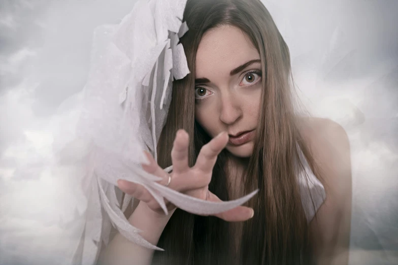 an artistic portrait of a woman wearing white