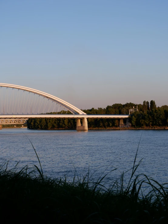 the bridge is high above the lake and is about to open up