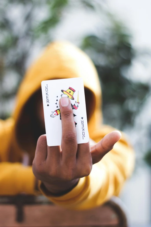 a man with a card in his hand