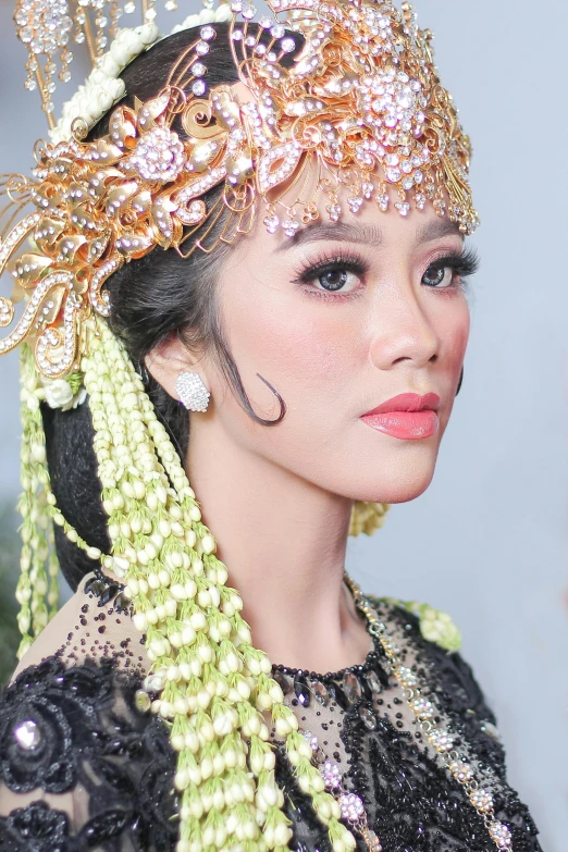 a young lady with an ornate headpiece