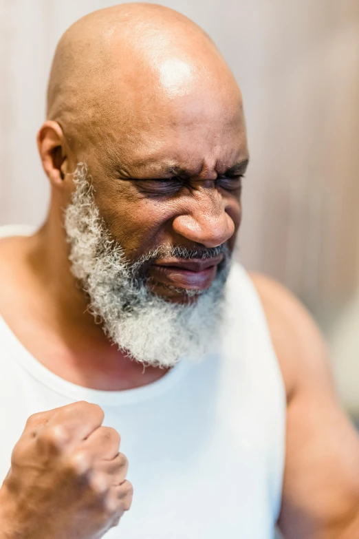 man with grey hair and white beard taking a selfie