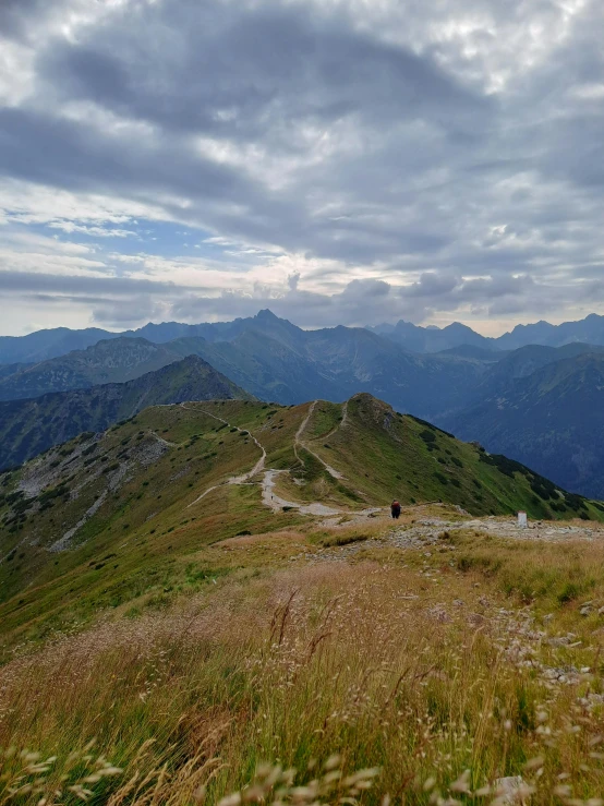 a person walking on the top of a mountain