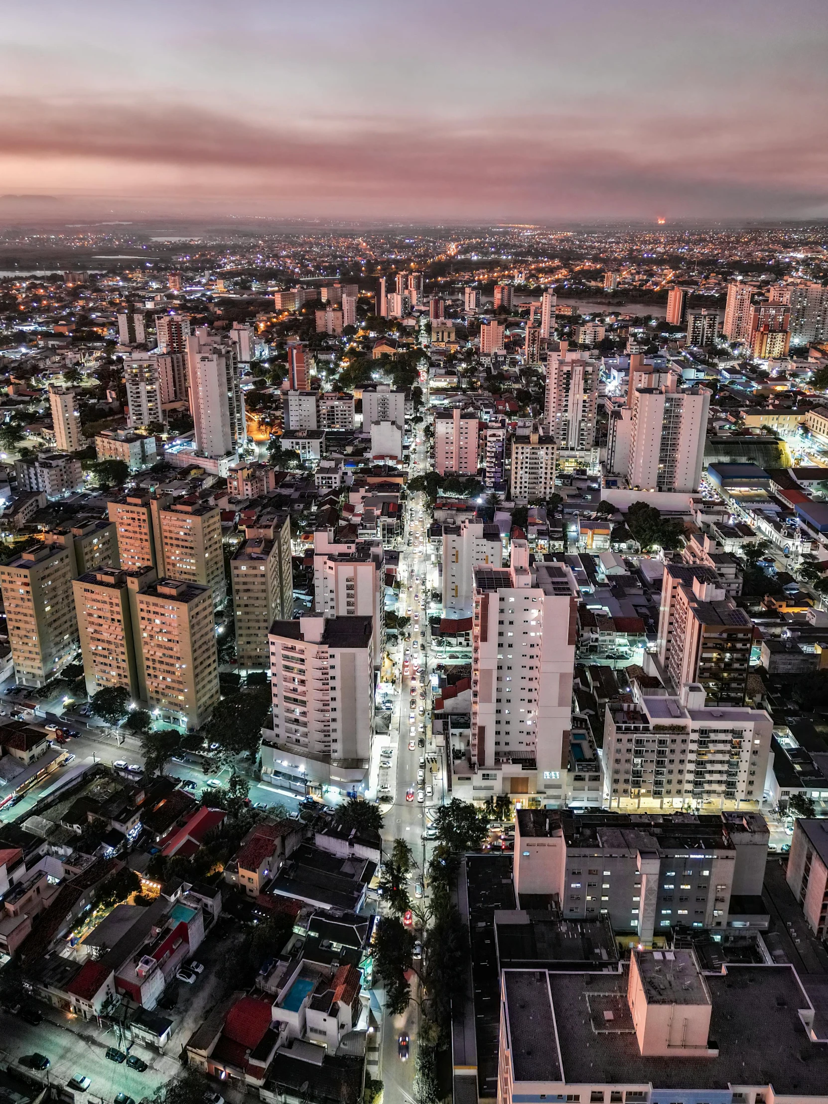 an aerial s of a city lit up at night