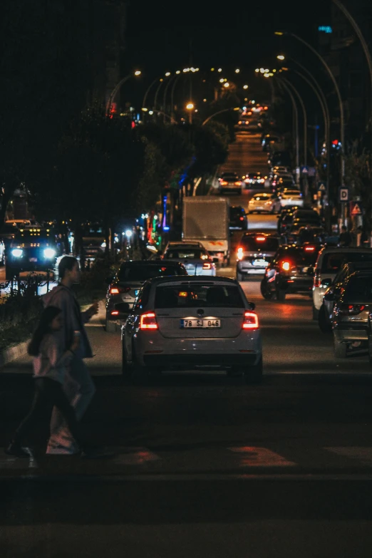 a traffic filled street with many vehicles driving on it