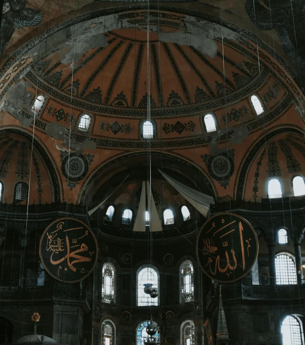 the interior of a large building with many arched windows